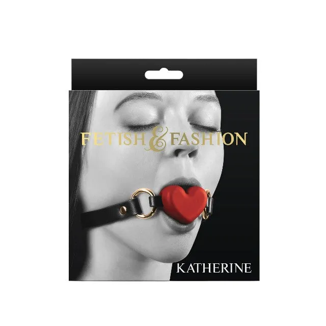 Căluș NS NOVELTIES Fetish & Fashion KATHERINE. pentru jocuri erotice BDSM. în formă de inimă. cu curea reglabilă. negru cu roșu